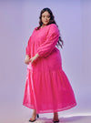 A woman dressed in Hot Pink Lola Cotton Eyelet Princess Dress