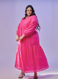 A woman dressed in Hot Pink Lola Cotton Eyelet Princess Dress
