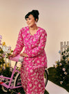 A woman dressed in Hot Pink Tun Habiba Eyelet Set