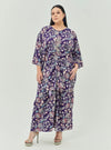 A woman dressed in Jowo Purple The Vintage Opah Kurung