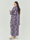 A woman dressed in Jowo Purple The Vintage Opah Kurung