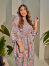 A woman dressed in Jowo Silver The Vintage Opah Kurung