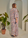 A woman dressed in Jowo Silver The Vintage Opah Kurung