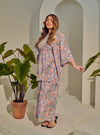 A woman dressed in Jowo Silver The Vintage Opah Kurung