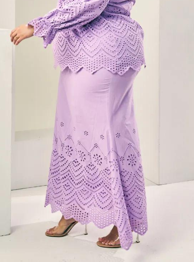 A woman wearing Lilac Ezzah Eyelet Doll Skirtv