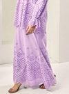 A woman wearing Lilac Ezzah Eyelet Doll Skirt