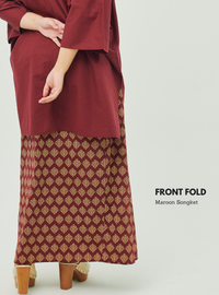 A woman dressed in Maroon Songket Front Fold Songket Skirt