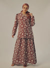 A woman dressed in Maroon Tun Habiba Eyelet Set
