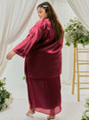 A woman dressed in Maroon Tun Seroja Satin Kurung Pahang