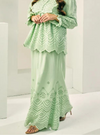 A woman wearing Mint Green Ezzah Eyelet Doll Skirt