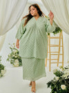 A woman dressed in Mint Green Tun Yasmin Eyelet Oversized Kurung