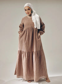 A woman dressed in Mocha Lola Cotton Eyelet Princess Dress