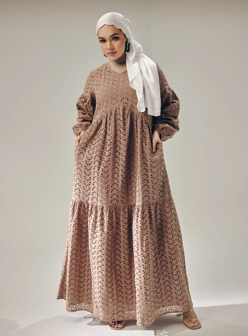 A woman dressed in Mocha Lola Cotton Eyelet Princess Dress
