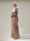 A woman dressed in Mocha Lola Cotton Eyelet Princess Dress