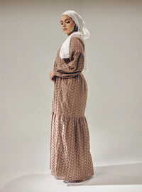 A woman dressed in Mocha Lola Cotton Eyelet Princess Dress