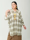A woman dressed in Mocha Tun Azeeza Kaftan Top