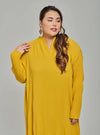 A woman dressed in Mustard Tun Aimellia Pleated Maxi Dress