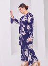 A woman dressed in Navy Aneesa Flower Printed Kurung