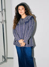 A woman dressed in Navy Maisara Eyelet Ruffles Top