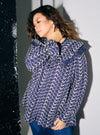 A woman dressed in Navy Maisara Eyelet Ruffles Top