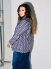 A woman dressed in Navy Maisara Eyelet Ruffles Top