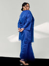 A woman in dressed in Navy Tun Sharimah Organza Kurung