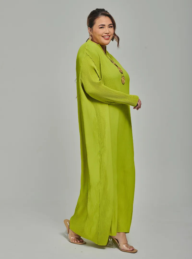 A woman dressed in Neon Green Tun Aimellia Pleated Maxi Dress