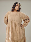 A woman dressed in Nude Lola Cotton Eyelet Princess Dress