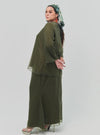 A woman dressed in Olive Tun Aminah Organza Basic Kurung