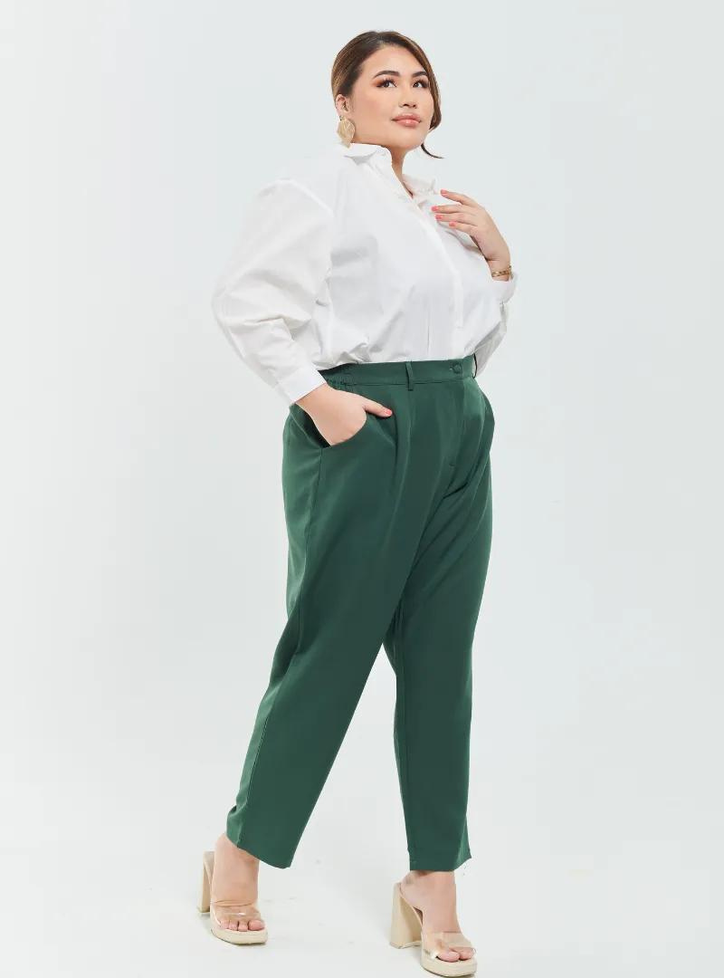 A woman wearing Pine Green Skinny Tuxedo Trouser