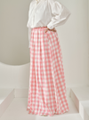 A woman wearing Pink Jane Checked Skirt