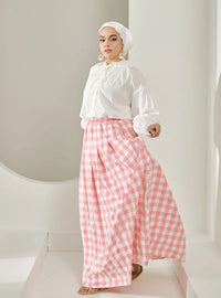 A woman wearing Pink Jane Checked Skirt