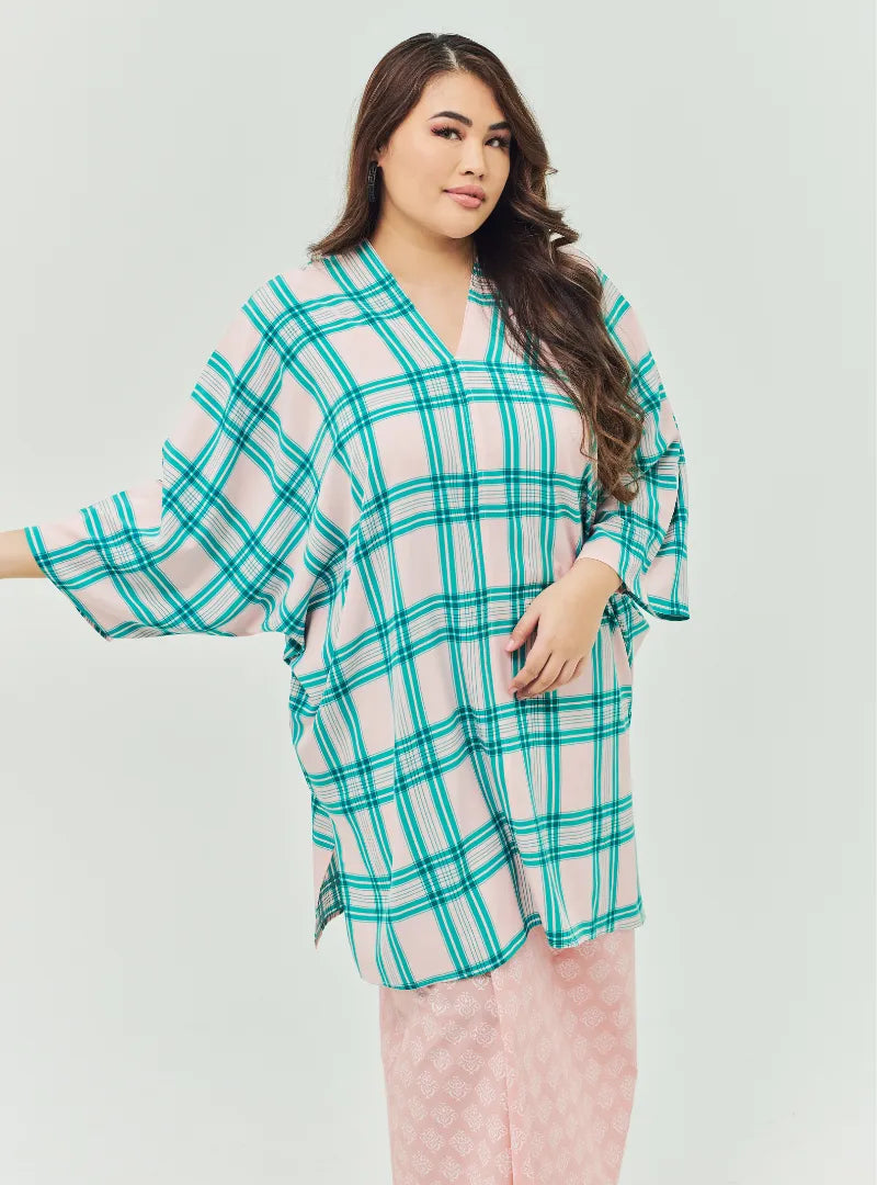 A woman dressed in Pink Tun Azeeza Kaftan Top