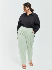 A woman wearing Pistachio Skinny Tuxedo Trouser
