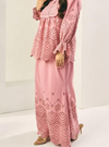 A woman wearing Plum Beauty Ezzah Eyelet Doll Skirt