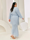 A woman in dressed in Powder Blue Tun Sharimah Organza Kurung
