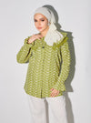 A woman dressed in Pucuk Pisang Maisara Eyelet Ruffles Top