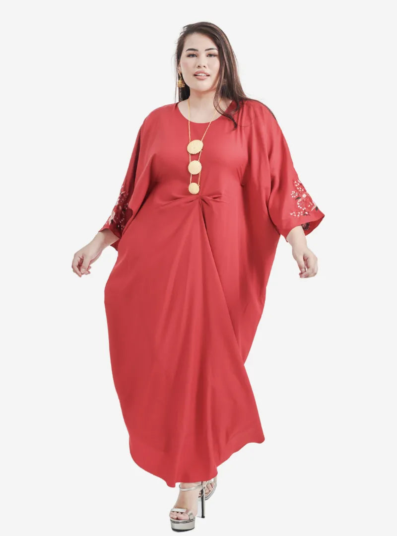 A woman dressed in Red Kak Ton Kaftan