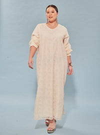 A woman dressed in Rice High Slit Long Lace Dress