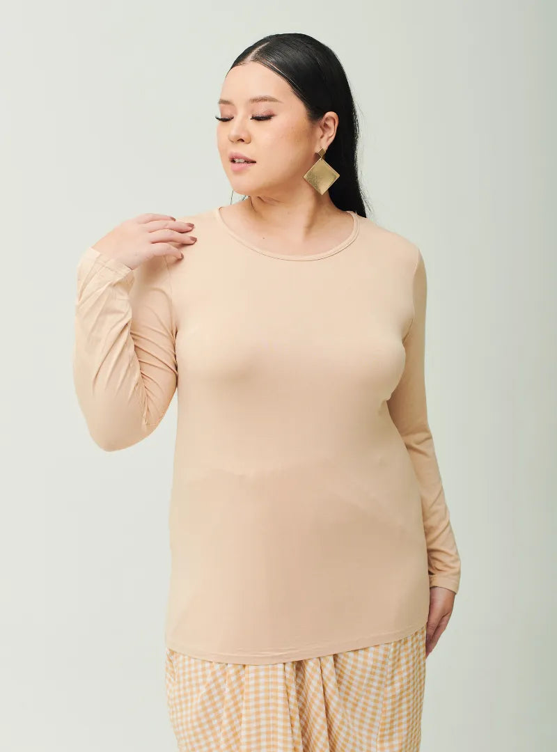 A woman dressed in Sand Cotton Basic Inner Top