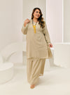 A woman dressed in Sage Tun Tipah Dotted Wrap Kurung