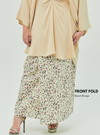 A woman dressed in Sand Bunga Front Fold Songket Skirt