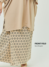 A woman dressed in Sand Songket Front Fold Songket Skirt