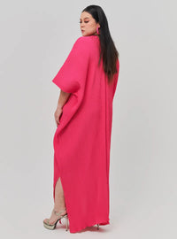 A woman Dressed in Hot Pink Signature Pleated Kaftan