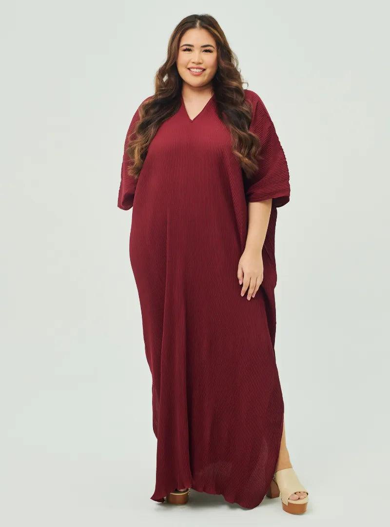A woman Dressed in Maroon Signature Pleated Kaftan