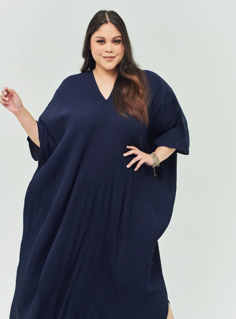A woman Dressed in Navy Signature Pleated Kaftan