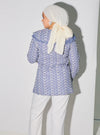 A woman dressed in Stone Blue Maisara Eyelet Ruffles Top