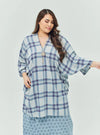 A woman dressed in Stone Blue Tun Azeeza Kaftan Top