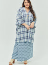 A woman dressed in Stone Blue Tun Azeeza Kaftan Top