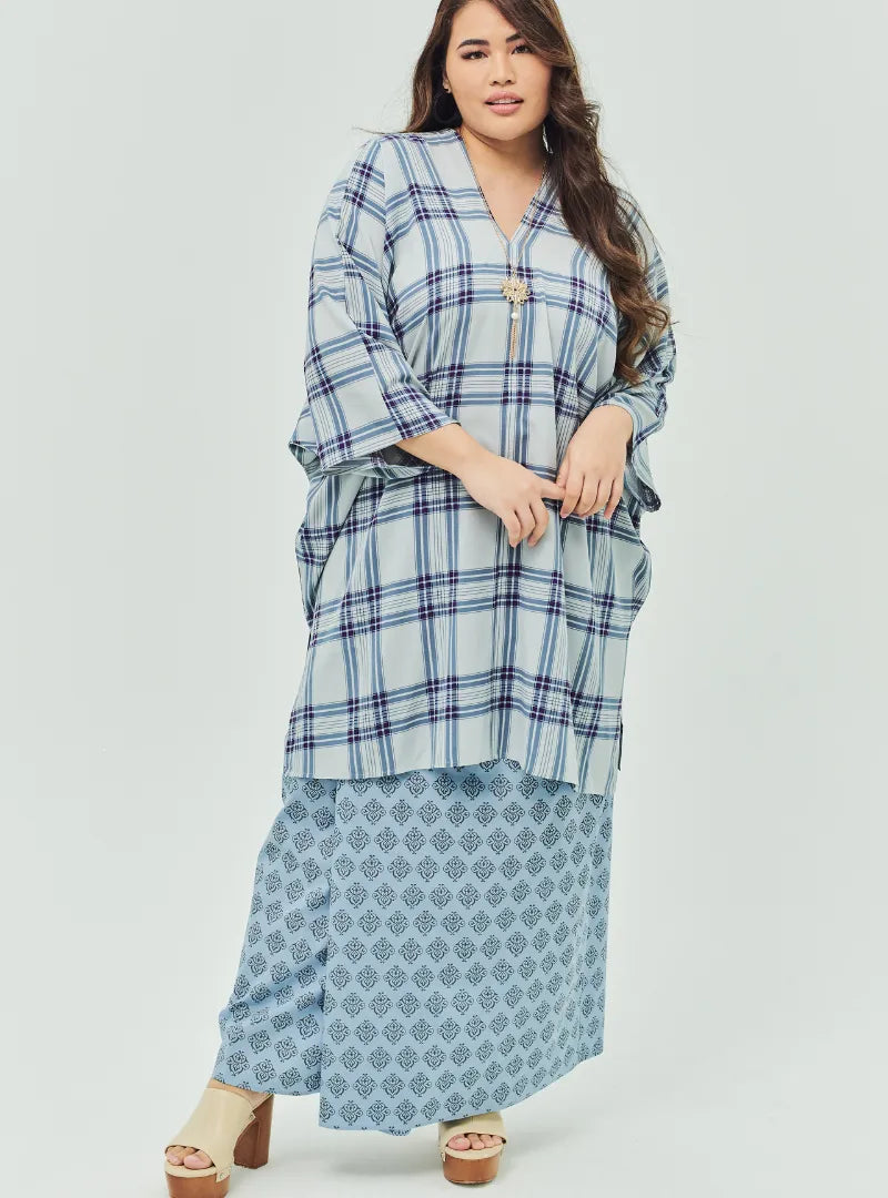 A woman dressed in Stone Blue Tun Azeeza Kaftan Top